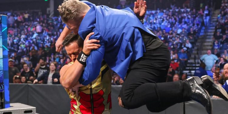 Pat McAfee and Austin Theory engaged in a fierce brawl