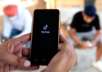 Indian mobile users browses through the Chinese owned video-sharing 'Tik Tok' app on a smartphones in Amritsar on June 30, 2020. - TikTok on June 30 denied sharing information on Indian users with the Chinese government, after New Delhi banned the wildly popular app citing national security and privacy concerns.."TikTok continues to comply with all data privacy and security requirements under Indian law and have not shared any information of our users in India with any foreign government, including the Chinese Government," said the company, which is owned by China's ByteDance. (Photo by NARINDER NANU / AFP) (Photo by NARINDER NANU/AFP via Getty Images)