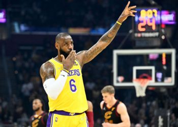 LeBron James of the LA Lakers waves to the crowd during the first quarter against the Cleveland Cavaliers at Rocket Mortgage Fieldhouse on March 21 in Cleveland, Ohio.