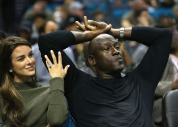 Michael Jordan watching his Charlotte Hornets