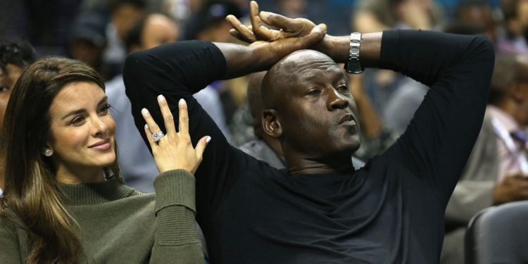 Michael Jordan watching his Charlotte Hornets