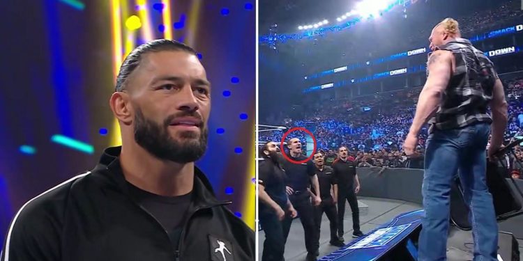 Roman Reigns watches as Lesnar confronts WWE's security personnel.