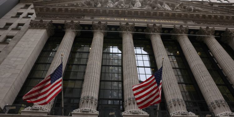 Wall St reverses gains, closes lower as aggressive Fed actions loom