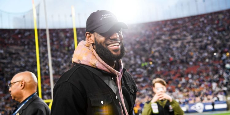 Divisional Round - Dallas Cowboys vs. LA Rams; LeBron James at an NFL playoff game matching two of his favorites against each other.