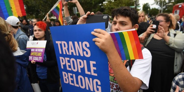 Demonstrators in favor of LGBT rights rally outside the US Supreme Court in Washington, DC, October 8, 2019, as the Court holds oral arguments in three cases dealing with workplace discrimination based on sexual orientation. (Photo by SAUL LOEB / AFP) (Photo by SAUL LOEB/AFP via Getty Images)