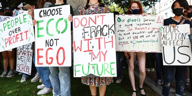 LOS ANGELES, CALIFORNIA - MARCH 25: Young climate activists participate in Youth Climate Strike LA outside City Hall on March 25, 2022 in Los Angeles, California. Students protested at youth climate strikes around the country to call for government action on climate change. (Photo by Mario Tama/Getty Images)