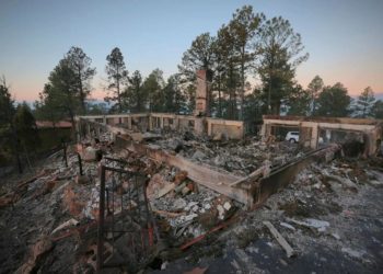 New Mexico village seeks prayers as deadly wildfire rages