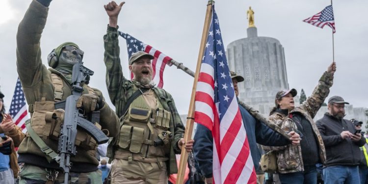 SALEM, OR - JANUARY 06: Armed supporters of President Trump chant during a protest on January 6, 2021 in Salem, Oregon. Trump supporters gathered at state capitals across the country to protest today's ratification of Joe Biden's Electoral College victory over President Trump in the 2020 election. (Photo by Nathan Howard/Getty Images)