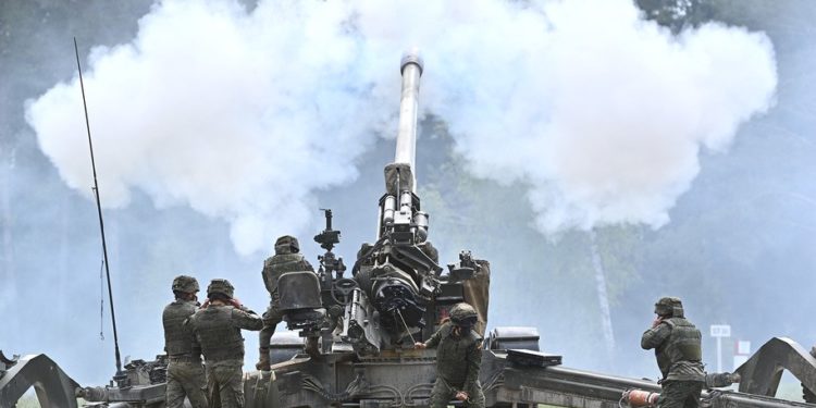GRAFENWOEHR, GERMANY - MAY 19: Soldiers of the Spanish Army fire a M777 howitzer artillery cannon during live fire exercises at the Grafenwoehr military training grounds on May 19, 2021 near Grafenwoehr, Germany. The exercises are taking place in the context of the "Fire Shock" series of long range, precision artillery exercises by the U.S. military with regional partners in Europe and Africa. (Photo by Lennart Preiss/Getty Images)
