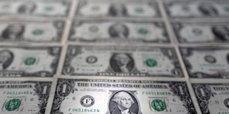 Dollar riding high after index hits 100 for first time in nearly two years