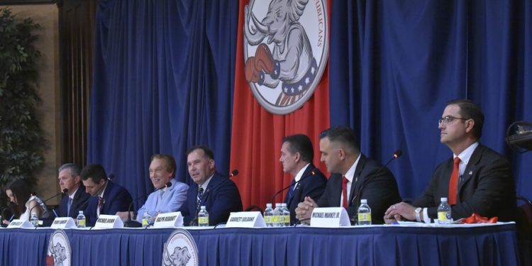 Candidates left to right; North Shores commentator Tudor Dixon, Metro Detroit businessman Kevin Rinke, Allendale real estate broker Ryan Kelley, Oakland County businessman Perry Johnson, MSP Captain Michael Brown, Oakland County Pastor Ralph Rebandt, Mattawan chiropractor Garrett Soldano and Grand Haven financial advisor Michael Markey participate in the Livingston County Republican Party GOP Gubernatorial debate at Crystal Gardens Event and Banquet Center in Howell, Mich., Thursday night, May 12, 2022. (Todd McInturf/Detroit News via AP)