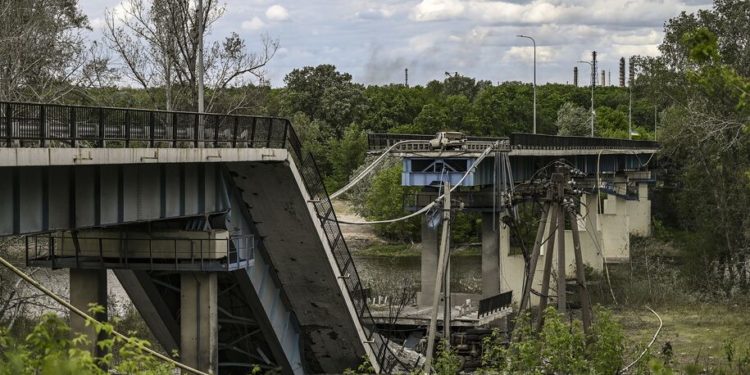 A photographs shows a downed bridge which connects the city of Lysychansk with the city of Severodonetsk in the eastern Ukranian region of Donbas, on the 88th day of the Russian invasion of Ukraine. (Photo by ARIS MESSINIS / AFP) (Photo by ARIS MESSINIS/AFP via Getty Images)