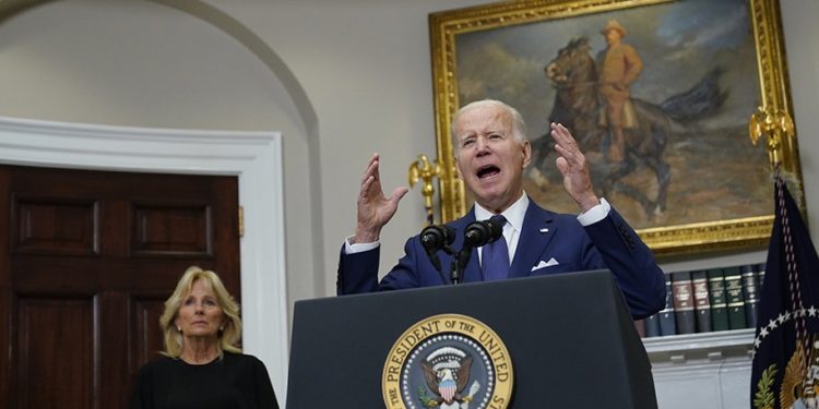 President Joe Biden speaks about the mass shooting at Robb Elementary School in Uvalde, Texas, from the White House, in Washington, Tuesday, May 24, 2022, as first lady Jill Biden listens. (AP Photo/Manuel Balce Ceneta)