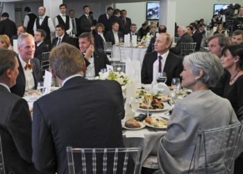 FILE- In this file photo taken on Thursday, Dec. 10, 2015, Russian President Vladimir Putin, center right, with retired U.S. Lt. Gen. Michael T. Flynn, center left, and Serbian filmmaker Emir Kusturica, obscured second right, attend an exhibition marking the 10th anniversary of RT (Russia Today) 24-hour English-language TV news channel in Moscow, Russia. Flynn is widely reported Thursday Nov. 17, 2016, to be a potential contender to become national security advisor to U.S. president elect Donald Trump, although his appointment may be controversial. (Mikhail Klimentyev/Sputnik, Kremlin Pool Photo via AP, file)