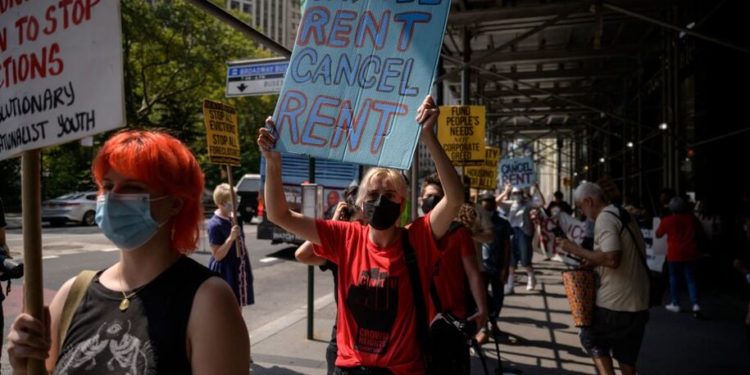 Demonstrators attend a rally calling for an extension of the state's eviction ban until 2022 and the cancellation of rent, in lower Manhattan, New York city on August 11, 2021. - Under pressure from progressive Democrats, US health authorities declared a new moratorium on evictions until October in much of the country, citing public health risks posed by the pandemic. (Photo by Ed JONES / AFP) (Photo by ED JONES/AFP via Getty Images)