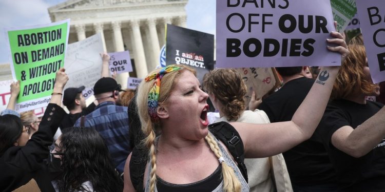 WASHINGTON, DC - MAY 03: Pro-choice and anti-abortion activists confront one another in front of the U.S. Supreme Court Building on May 03, 2022 in Washington, DC. In a leaked initial draft majority opinion obtained by Politico and authenticated by Chief Justice John Roberts, Supreme Court Justice Samuel Alito wrote that the cases Roe v. Wade and Planned Parenthood of Southeastern Pennsylvania v. Casey should be overturned, which would end federal protection of abortion rights across the country. (Photo by Win McNamee/Getty Images)