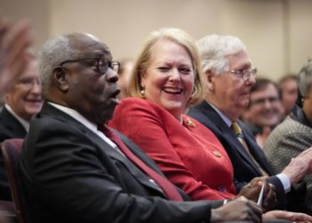 WASHINGTON, DC - OCTOBER 21: (L-R) Associate Supreme Court Justice Clarence Thomas sits with his wife and conservative activist Virginia Thomas while he waits to speak at the Heritage Foundation on October 21, 2021 in Washington, DC. Clarence Thomas has now served on the Supreme Court for 30 years. He was nominated by former President George H. W.  Bush in 1991 and is the second African-American to serve on the high court, following Justice Thurgood Marshall. (Photo by Drew Angerer/Getty Images)