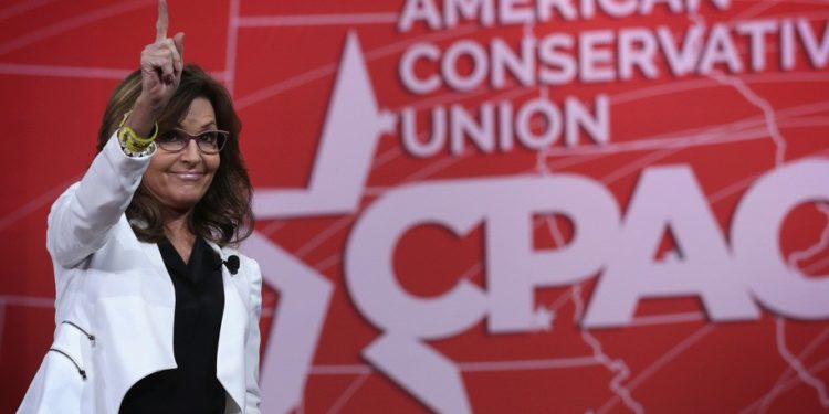 NATIONAL HARBOR, MD - FEBRUARY 26:  Former Alaska Governor Sarah Palin acknowledges the crowd after she addressed the 42nd annual Conservative Political Action Conference (CPAC) February 26, 2015 in National Harbor, Maryland. Conservative activists attended the annual political conference to discuss their agenda.  (Photo by Alex Wong/Getty Images)