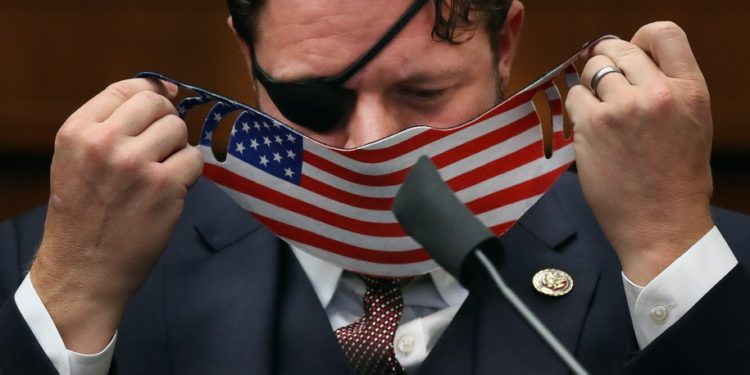 US Representative Dan Crenshaw attends a House Homeland Security Committee hearing about "Worldwide threats to the Homeland" on Capitol Hill on September 17, 2020 in Washington, DC. (Photo by Chip Somodevilla / POOL / AFP) (Photo by CHIP SOMODEVILLA/POOL/AFP via Getty Images)