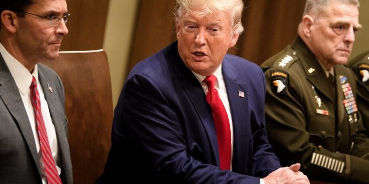 US Secretary of Defense Mark Esper (L) and Chairman of the Joint Chiefs of Staff Army General Mark A. Milley (R) listen while US President Donald Trump speaks before a meeting with senior military leaders in the Cabinet Room of the White House in Washington DC on October 7, 2019. (Photo by Brendan Smialowski / AFP) (Photo by BRENDAN SMIALOWSKI/AFP via Getty Images)