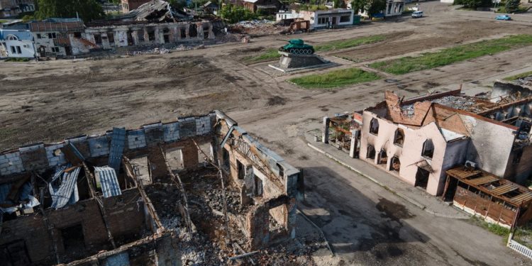 TROSTYANETS, UKRAINE - JUNE 02: Destroyed buildings are seen next to a damaged Soviet tank monument on June 2, 2022 in Trostyanets, Ukraine. Russian forces occupied large swaths of the Sumy region after Moscow invaded Ukraine on Feb. 24, before Ukrainian forces retook control of the area in April. Russia has since concentrated its war effort in the south and east of the country. (Photo by Alexey Furman/Getty Images)
