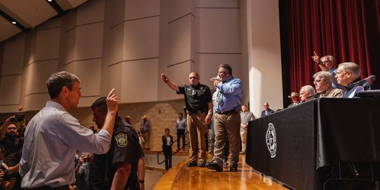 UVALDE, TX - MAY 25: Democratic gubernatorial candidate Beto O'Rourke interrupts a press conference held by Texas Gov. Greg Abbott following a shooting yesterday at Robb Elementary School which left 21 dead including 19 children, on May 25, 2022 in Uvalde, Texas. The shooter, identified as 18 year old Salvador Ramos, was reportedly killed by law enforcement. (Photo by Jordan Vonderhaar/Getty Images)