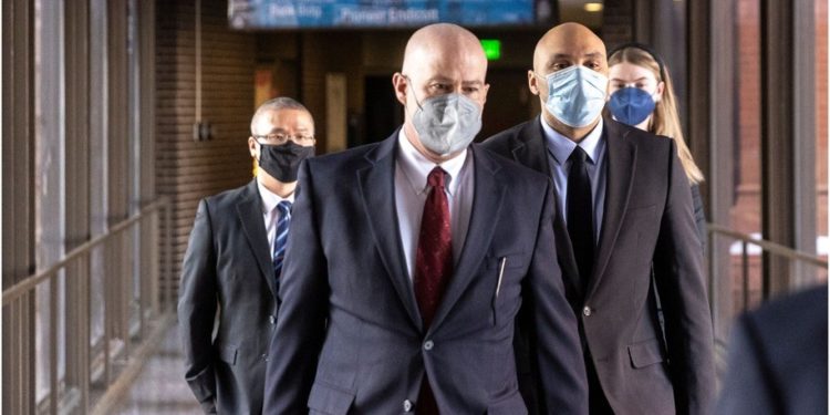 Former Minneapolis Police Officers J. Alexander Kueng (R) and Tou Thao (L) arrive with and attorney Thomas Plunkett (C) at the US District Court in St. Paul, Minnesota, on January 11, 2022, for the pre-trial of three former Minneapolis police officers charged with federal civil rights violations in George Floyd's death.