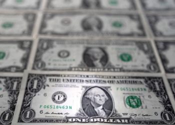 U.S. dollar slides as markets re-evaluate Fed rate path