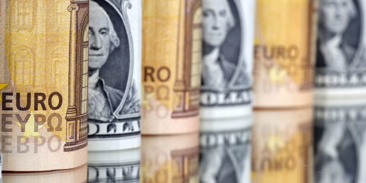 Dollar dips as rate hike bets ease