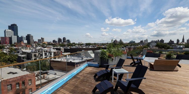A tree (house) grows in Brooklyn; six-story apartment building has wooden beams