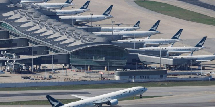 Cathay Pacific narrows loss but COVID rules on crew cloud outlook