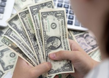 Worst not over for EM currencies as U.S. dollar thunders on: Reuters poll