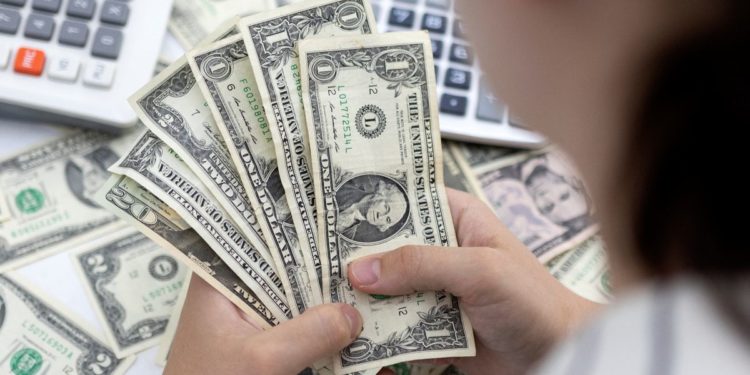 Worst not over for EM currencies as U.S. dollar thunders on: Reuters poll