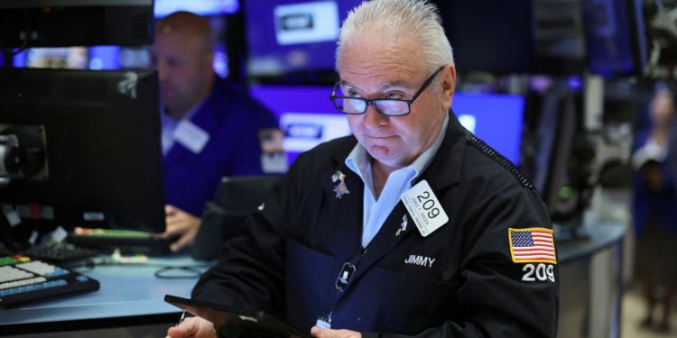 Stocks gyrate, dollar gains as Fed keeps hawkish stance