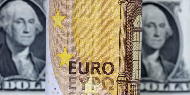 Euro jumps on hawkish ECB signals, softer dollar