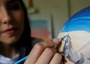 Paraguay artist who painted boots for Messi looks to bring color to World Cup