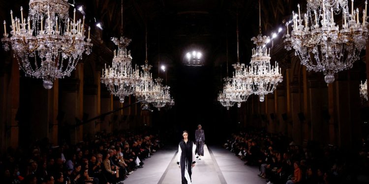 Under a cloud of belt-tightening, Paris Fashion Week struts on
