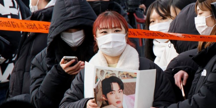 BTS star Jin begins South Korea army duty amid tight security, cheering fans