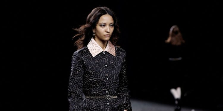 Chanel takes glittering, camellia-themed line-up to Paris catwalk