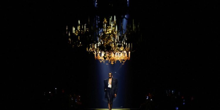 Saint Laurent hits Paris catwalk with broad-shouldered glamour