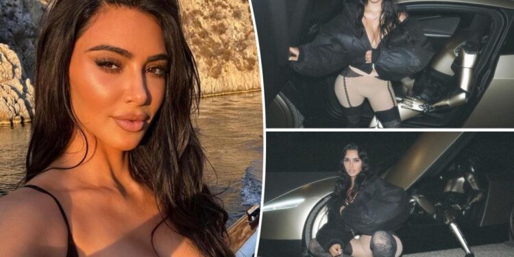 Kim Kardashian denies Tesla paid her to pose with robot in polarizing photo shoot