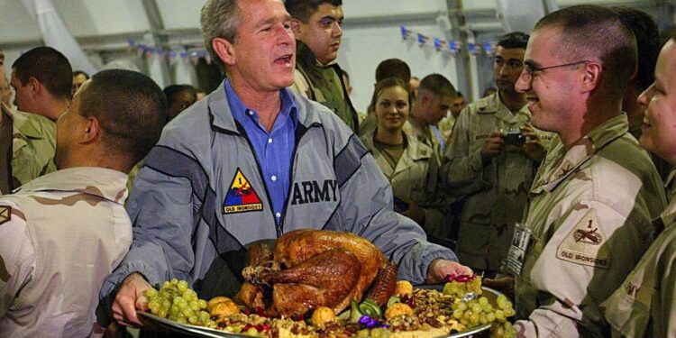 November 27, President George W. Bush spends Thanksgiving with U.S. troops in Iraq