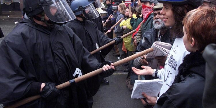November 30, WTO protesters and police clash in Seattle
