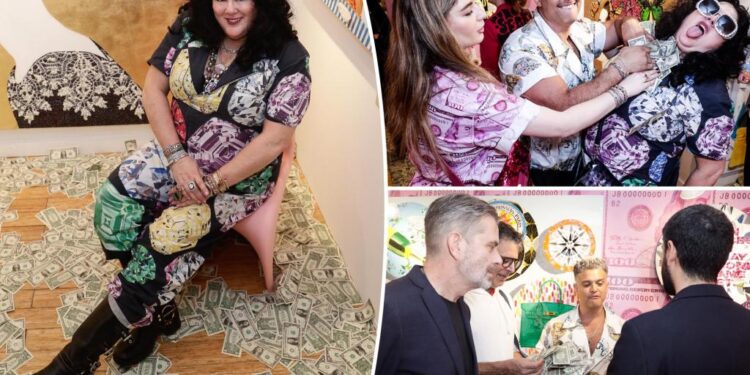Guests grab wads of cash from Ashley Longshore's art show